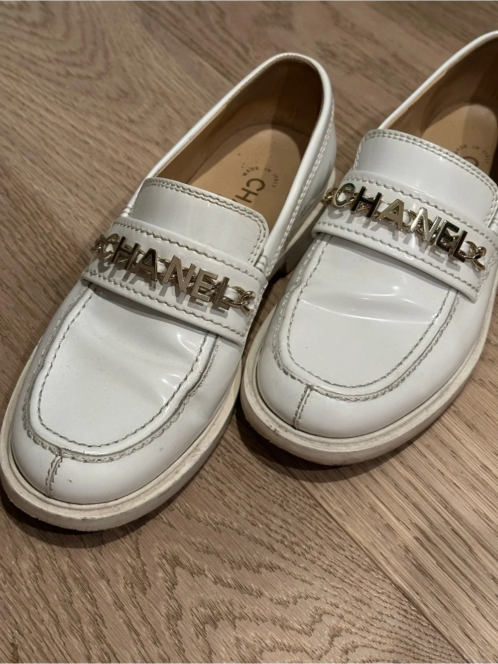 CHANEL Cream Leather Logo Chain Loafers